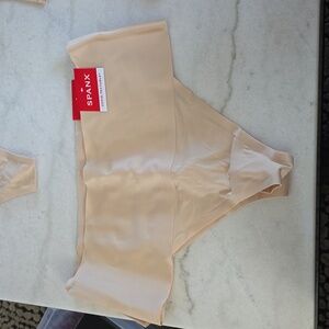 NWT Spanx undie-tectable nude thongs